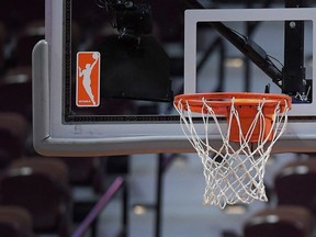 The file - the Wnba logo and hoop are visible at the Wnba basketball match on Mohegan Sun Arena, on Tuesday, May 14, 2019, in Uncasville, Conn.