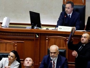 Opposition political parties have questioned the transparency of the AI minister. (Adnan Beci/AFP)