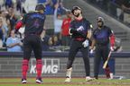 Blue Jays' Nathan Lukes (right) celebrates with George Springer after hitting a two-run home run off Tampa Bay Rays pitcher Adrian Houser during the fifth inning in Toronto on Friday, Sept. 26, 2025.