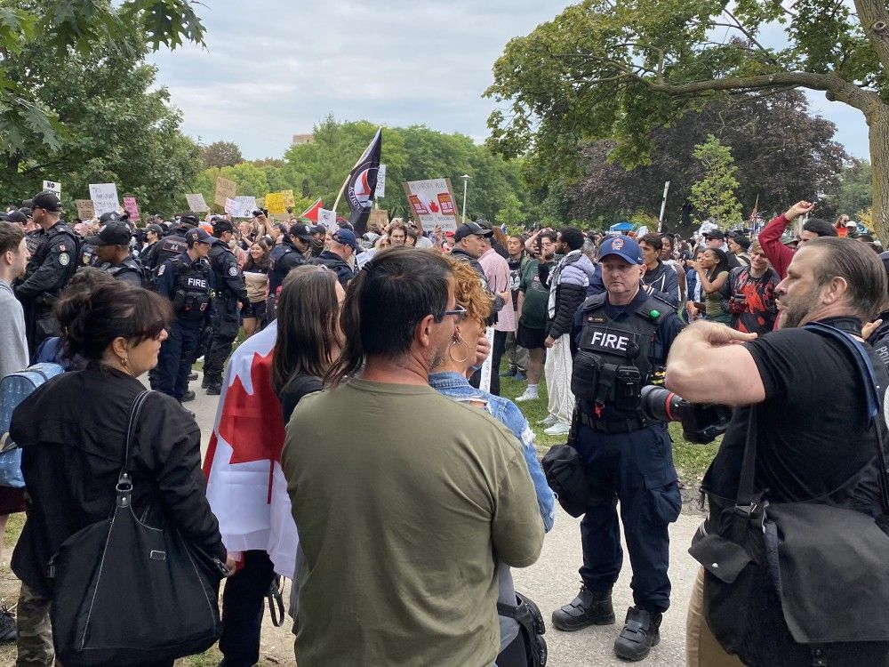 Toronto police say they have arrested six people at a pro- and anti-immigration demonstration as the opposing groups faced off at a park.