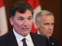 President of the King’s Privy Council for Canada Dominic LeBlanc speaks at a press conference while Prime Minister Mark Carney listens, on Parliament Hill in Ottawa, Thursday, June 19, 2025.