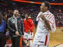Singer Drake shares a laugh with Toronto Raptors Kyle Lowry (middle) and DeMar DeRozan in 2016.