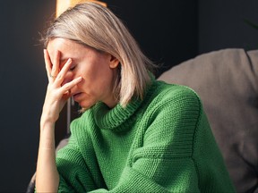 Middle age Sad Woman at Home