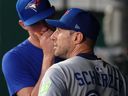 Blue Jays pitcher Max Scherzer watches from the dugout after leaving the game in the first inning against the Royals at Kauffman Stadium in Kansas City, Mo., Friday, Sept. 19, 2025.
