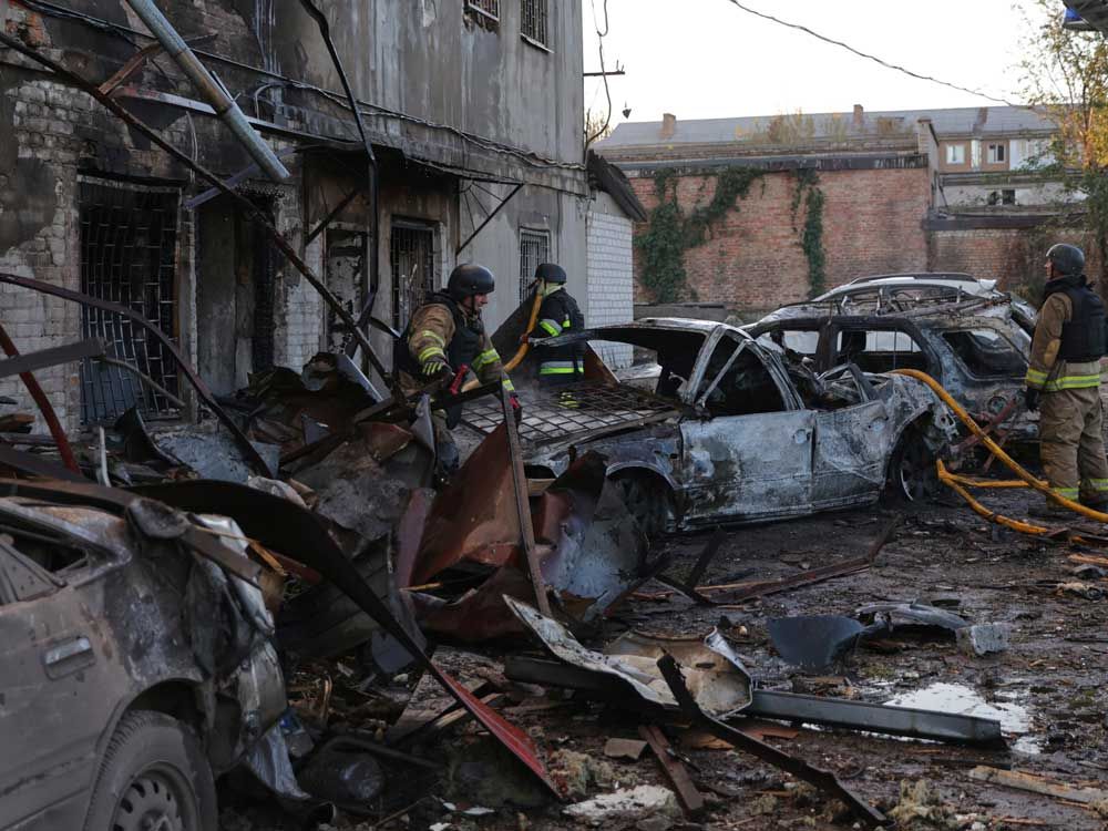 Rescuers work at a building destroyed during a Russian strike in Zaporizhzhia, Ukraine, Monday, Sept. 22, 2025.  