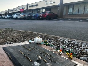 Tributes lay on a memorial Friday, Sept. 26, 2025, for four teenage girls who were killed in a yogurt shop in 1991 in Austin, Texas.