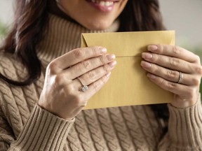 A woman wonders why her husband's friend's wife always leaves her name out of their holiday cards.