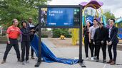 Mayor Olivia Chow, with Councillor Jamaal Myers to her left, unveils a sign at newly renamed Cynthia Lai Park in September 2025.