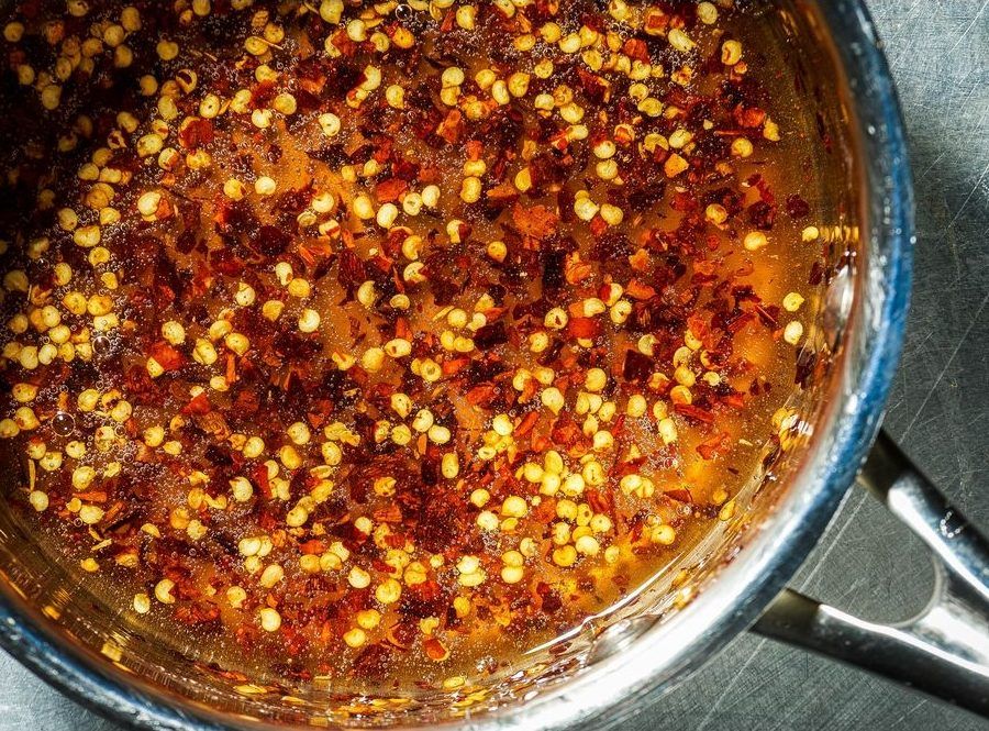 Hot honey, whether homemade or store-bought, and corn can be a great pizza topping.