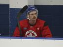 Toronto Maple Leafs defenseman Simon Benoit sits on the bench during practice last month.