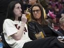 Indiana Fever head coach Stephanie White (right) talks with Caitlin Clark before a WNBA game against the Chicago Sky earlier this year.