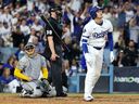 Shohei Ohtani of the Los Angeles Dodgers looks on after hitting a home run in the fourth inning against the Milwaukee Brewers in game four of the National League Championship Series.