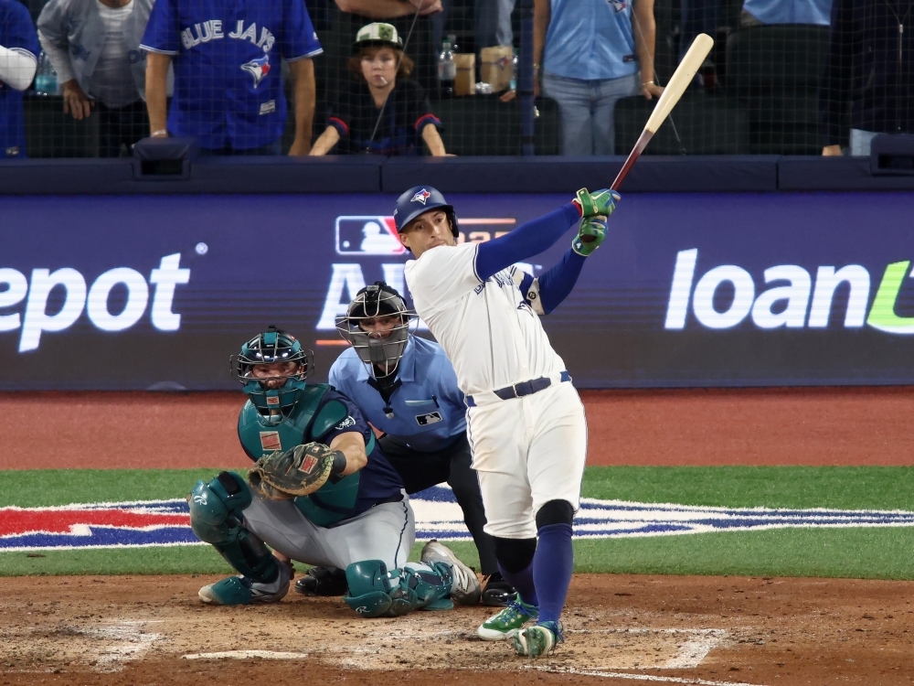 George Springer of the Toronto Blue Jays hits a three-run home run against the Seattle Mariners during the seventh inning in Game 7 of the ALCS. George Springer of the Toronto Blue Jays hits a three-run home run against the Seattle Mariners during the seventh inning in Game 7 of the ALCS.