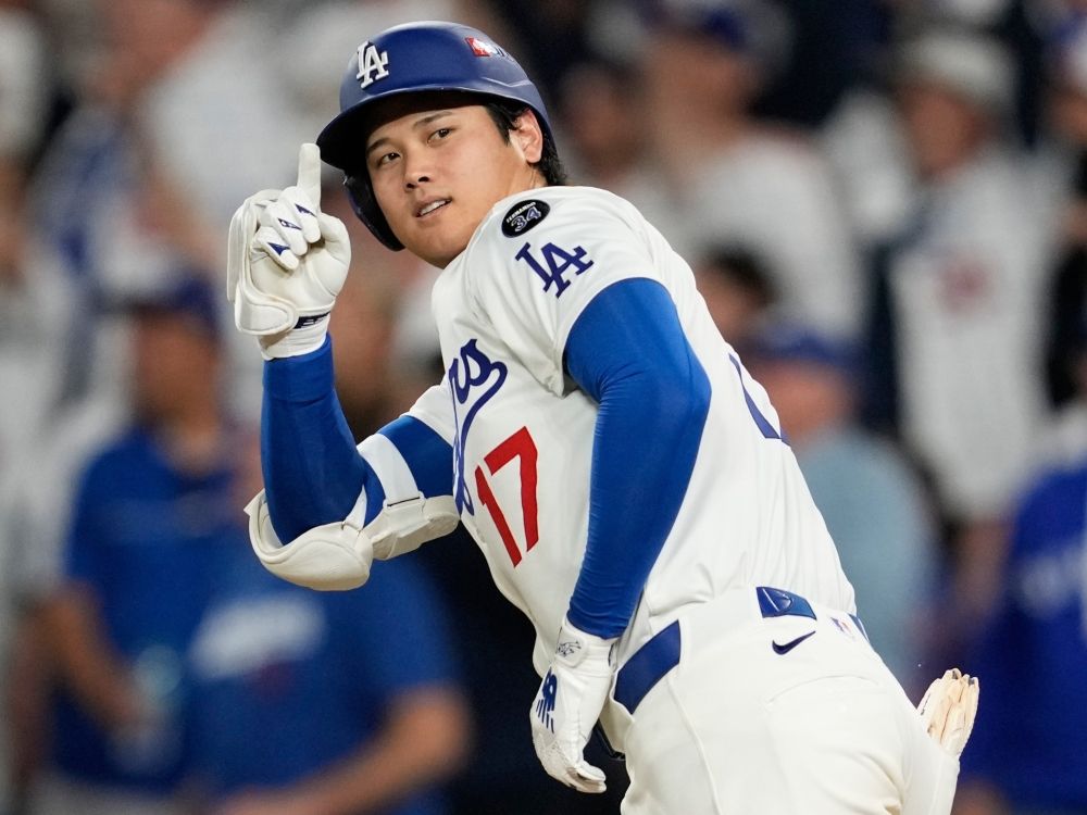Shohei Ohtani of the Los Angeles Dodgers celebrates a home run against the Milwaukee Brewers during the NLCS.