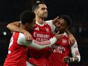 From left: Arsenal's Ethan Nwaneri celebrates scoring the opening goal with Mikel Merino and Myles Lewis-Skelly during the English League Cup fourth round football match against Brighton and Hove Albion.