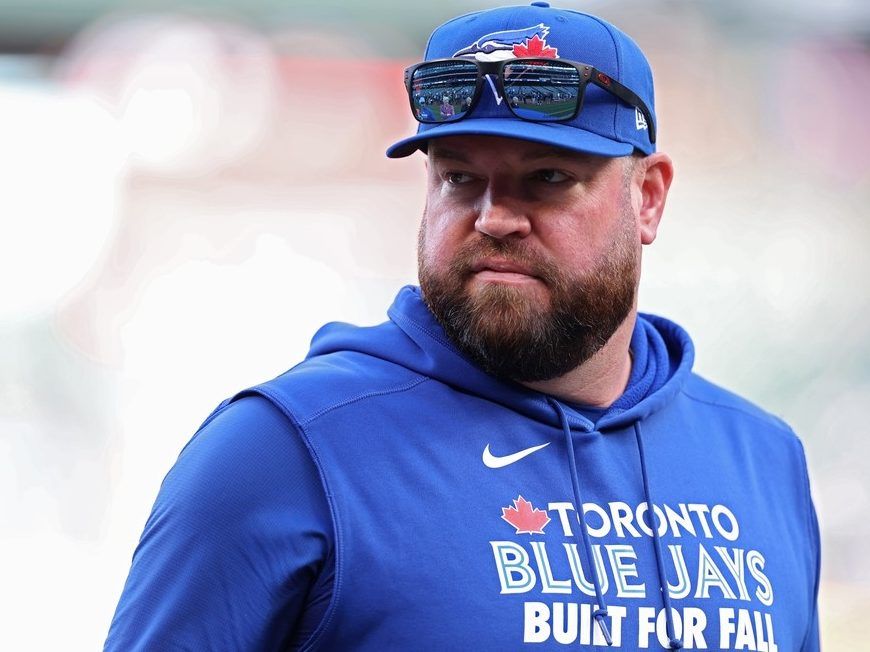 Manager John Schneider of the Toronto Blue Jays looks on before game three of the American League Championship Series against the Seattle Mariners at T-Mobile Park on October 15, 2025 in Seattle, Washington.