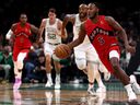 Immanuel Quickley #5 of the Toronto Raptors dribbles in the low court against the Boston Celtics during a preseason game at TD Garden on October 15, 2025 in Boston, Massachusetts.