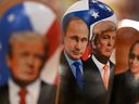 Traditional Russian wooden nesting dolls, nesting dolls depicting Russian President Vladimir Putin and US President Donald Trump, are put up for sale in a souvenir shop on the tourist Arbat street in central Moscow on October 21, 2025. On October 21, 2025, Russia announced that there was