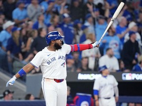 Vladimir Guerrero Jr. of the Blue Jays hits a home run against the Mariners in Toronto on October 19, 2025.
