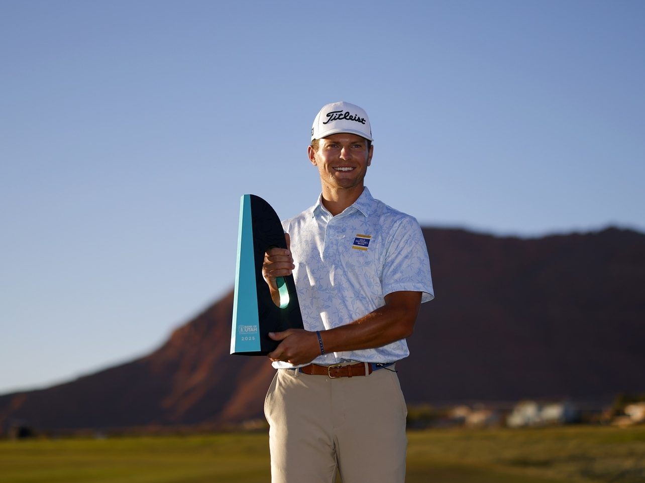 Michael Brennan from the USA poses with the trophy.