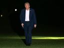 President Donald Trump walks on the South Lawn of the White House early Tuesday, Oct. 14, 2025, in Washington after returning from a trip to Israel and Egypt.