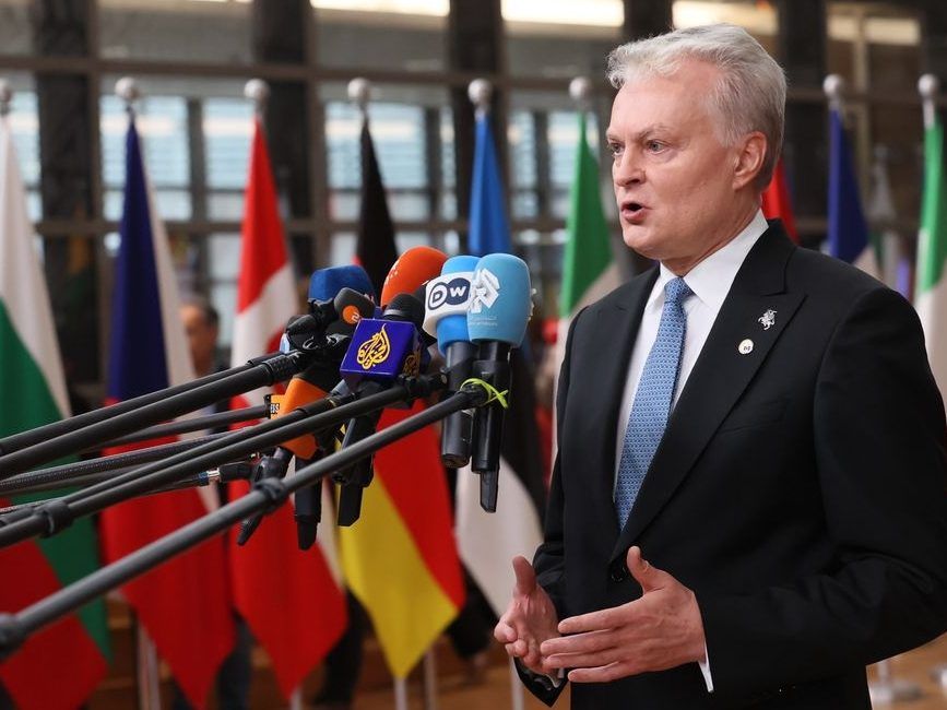 Lithuanian President Gitanas Nausėda speaks to the media upon arrival for the EU summit at the European Council building in Brussels on Thursday, October 23, 2025.