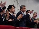 U.S. Defense Secretary Pete Hegseth (center right), Japanese Prime Minister Sanae Takaichi (left) and Defense Secretary Shinjiro Koizumi gesture as President Donald Trump speaks with military personnel aboard the aircraft carrier USS George Washington moored at the U.S. naval base in Yokosuka, south of Tokyo, Tuesday, Oct. 28, 2025.