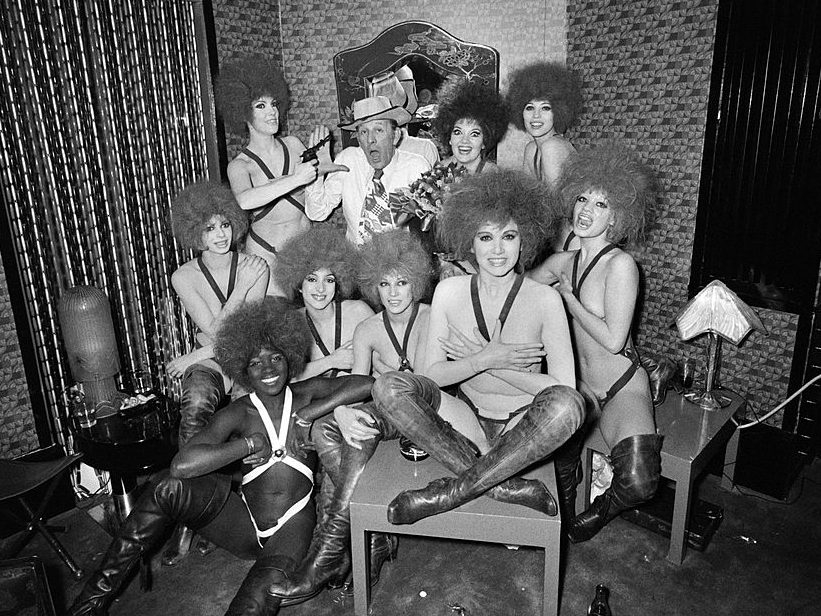 Alain Bernardin, founder of the Crazy Horse Saloon, surrounded by his dancing girls at the end of the show performed to feast the beginning of the new year in 1970. (ARCHIVE/AFP/Getty Images)  Alain Bernardin, founder of the Crazy Horse Saloon, surrounded by his dancing girls at the end of the show performed to feast the beginning of the new year in 1970. (ARCHIVE/AFP/Getty Images)