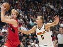Grady Dick #1 of the Toronto Raptors tries to pass Hunter Tyson #5 of the Denver Nuggets during the second half of an NBA preseason game at Rogers Arena on Oct. 6.