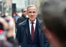 Prime Minister Mark Carney walks along Sparks St. in Ottawa, ON. on Friday, May 2, 2025.