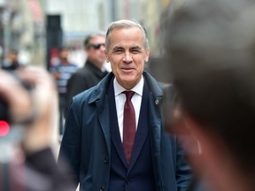 Prime Minister Mark Carney walks along Sparks St. in Ottawa, ON. on Friday, May 2, 2025.