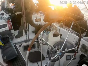 This frame shot from a video released by the global underwater Imain Flotillam, since the soldiers of the Israeli military -marine fleet rule one of the vessels of the flotilla when they approach the coast of Gaza at the beginning of Thursday, 2025.
