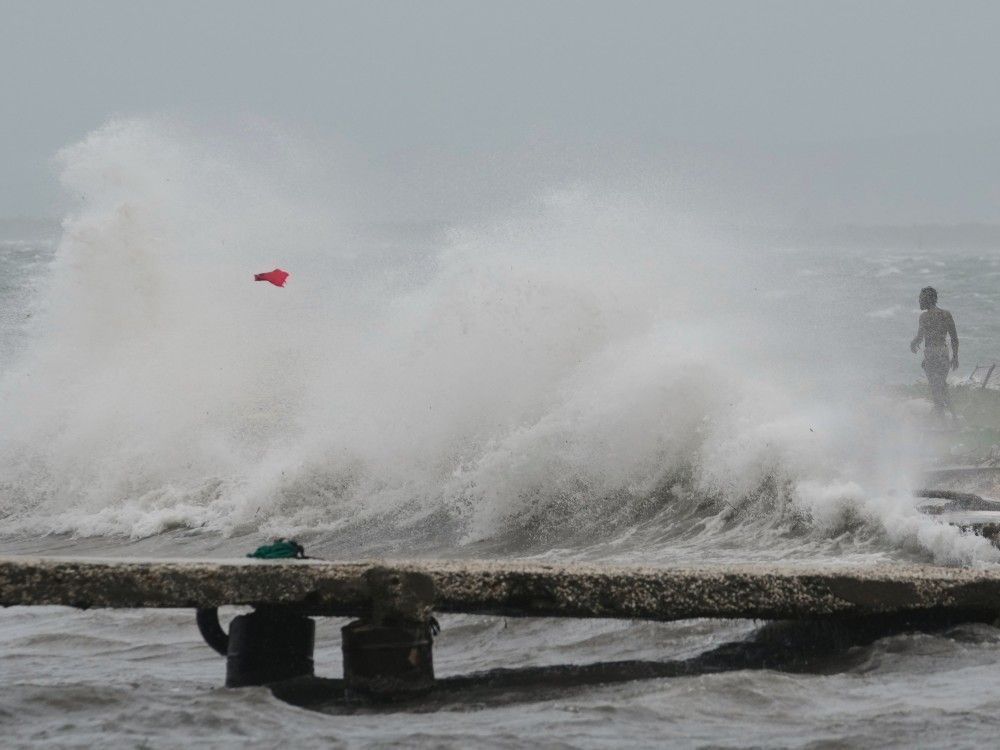 Waves splash in Kingston, Jamaica, as Hurricane Melissa approaches, Tuesday, October 28, 2025.