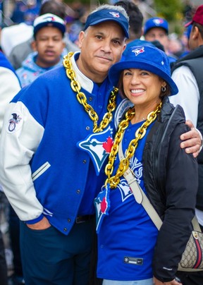 Jennifer Monaco and Matt Osborne, stand outside Rogers Centre before the Toronto Blue Jays hosted the Los Angeles Dodgers in Game 1 of the World Series on Friday, Oct. 24, 2025.