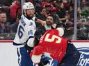 Tampa Bay Lightning right-winger Scott Sabourin (46) punches Florida Panthers defenseman Aaron Ekblad during the first period of an NHL hockey preseason game, Saturday, Oct. 4, 2025, in Sunrise, Fla.