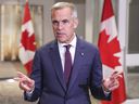 Prime Minister Mark Carney speaks to the media at the Liberal Cabinet retreat in Toronto on Wednesday, September 3, 2025.