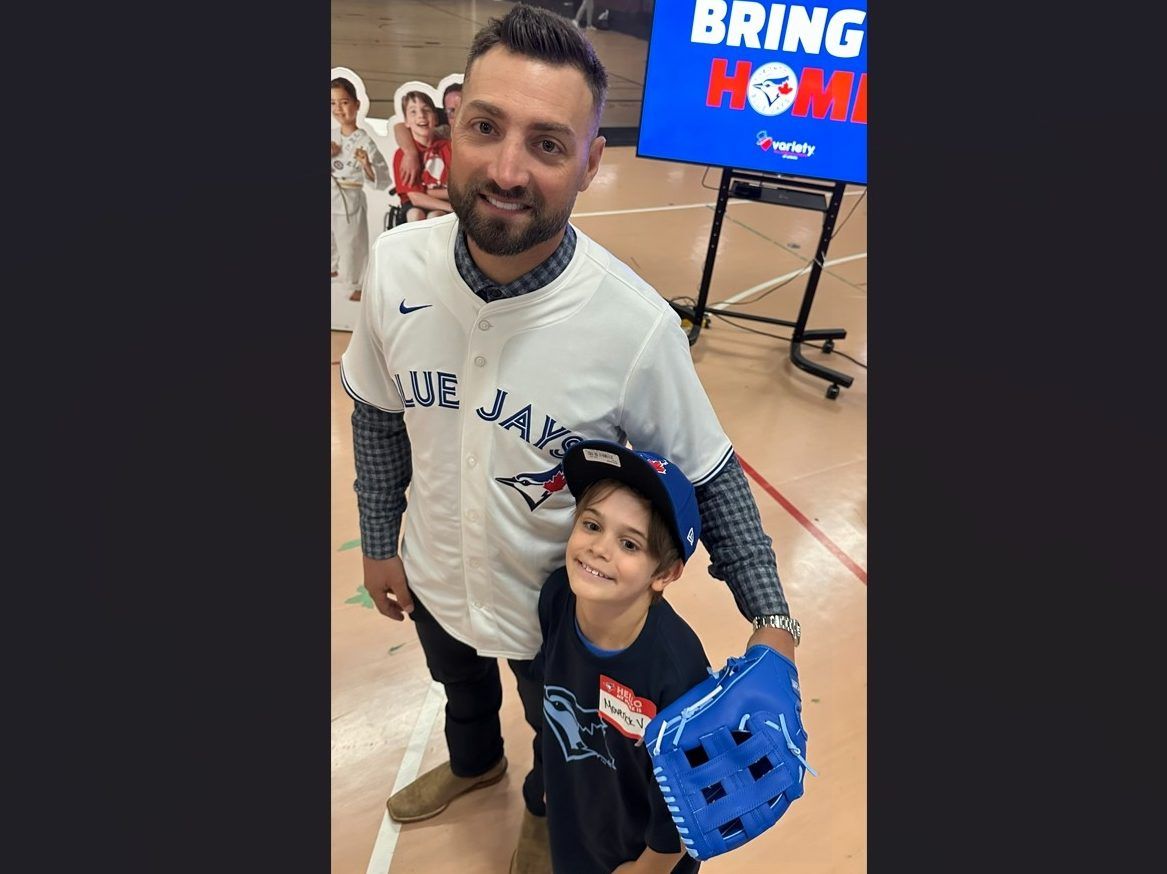 Maverick “Mavi” Valle, 9, poses with former Blue Jays star Kevin Pillar after recently hitting a double the Fall Classic Legacy Initiative at Variety Village in Scarborough.
