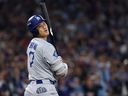 Shohei Ohtani of the Los Angeles Dodgers reacts to being hit during the fifth inning against the Toronto Blue Jays in Game 1 of the 2025 World Series at Rogers Center on October 24, 2025 in Toronto.