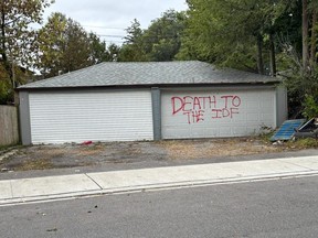 Anti-Israel graffiti is seen on a building in Cedarvale Ravine Park in Toronto.