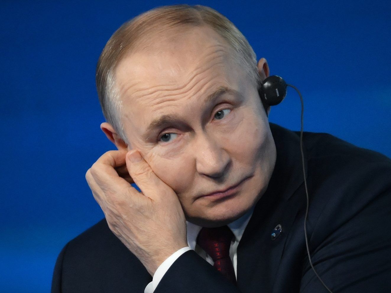 Vladimir Putin answers questions during a meeting with foreign policy experts.