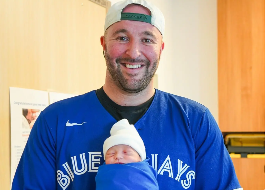 Mark Galea of ​​Oakville watched the Jays' historic sixth game on Oct. 19 with his newborn son Julian in his lap at Oakville Trafalgar Memorial Hospital at 11 a.m. that day. 