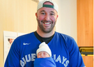 Mark Galea of Oakville watched the Jays' historic sixth game on Oct. 19 with his newborn son Julian in his lap at Oakville Trafalgar Memorial Hospital at 11 a.m. that day.