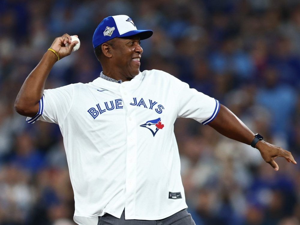 Former Toronto Blue Jays player Joe Carter throws out the ceremonial first pitch before Game 2 of the 2025 World Series against the Los Angeles Dodgers at Rogers Center on October 25, 2025 in Toronto.