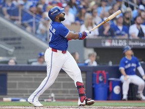 Blue Jays batter Vladimir Guerrero Jr. hits a solo home run against the New York Yankees during the first inning of Game 1 of the AL Division Series at Rogers Centre in Toronto, Saturday, on Oct. 4, 2025.