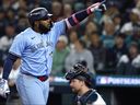Vladimir Guerrero Jr. No. 27 of the Toronto Blue Jays celebrates a solo home run against the Seattle Mariners during the seventh inning of Game 4 of the American League Championship Series at T-Mobile Park on Thursday.