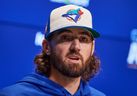 Toronto Blue Jays' Kevin Gausman speaks with media ahead of Game 1 of the American League Championship Series against the Seattle Mariners in Toronto, on Saturday, Oct. 11, 2025.