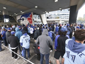 Toronto Blue Jays fans wait to enter Rogers Centre