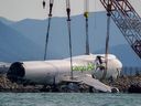 The wreckage of a cargo plane that skidded off the runway at Hong Kong International Airport is being prepared for removal on Sunday, October 26, 2025.