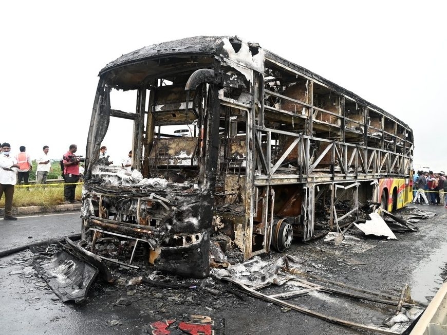 Bus catches fire after being hit by a motorcycle in southern India, killing at least 25