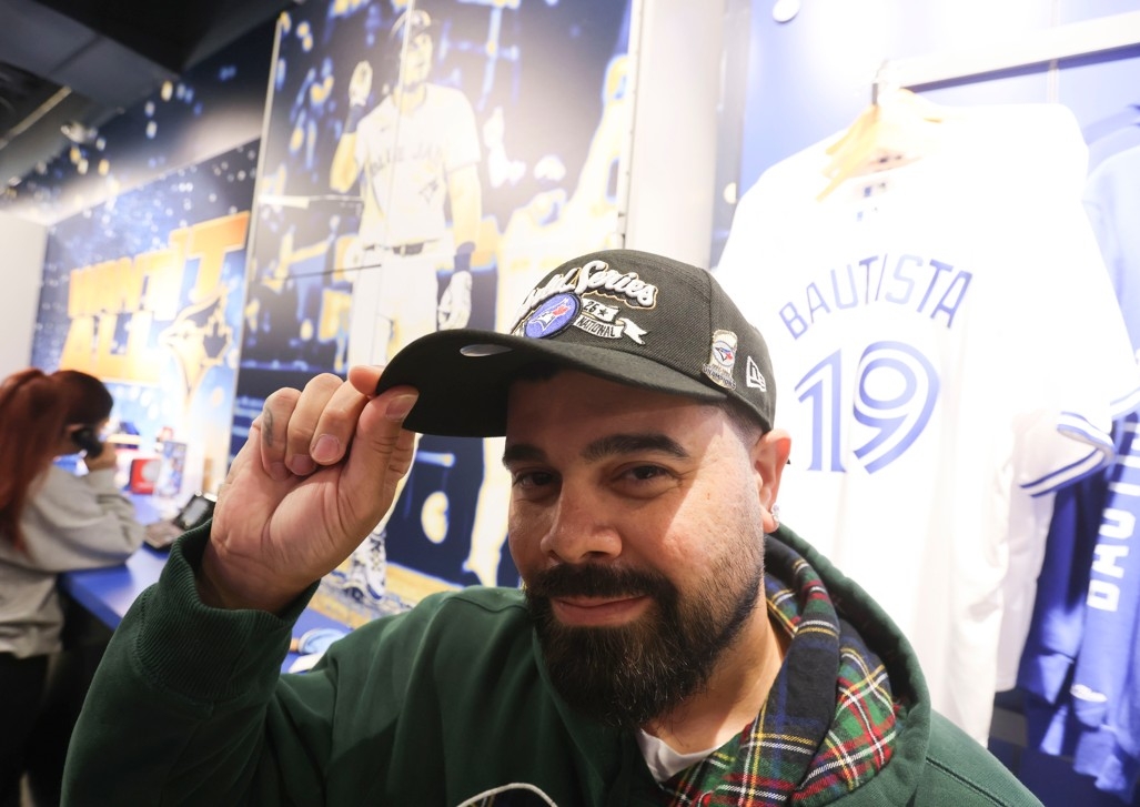 Excited about the start of the World Series, Toronto Blue Jays fans like Joseph Khargie loaded up on coveted merchandise at the Jays Shop on Thursday, Oct. 23, 2025. Excited about the start of the World Series, Toronto Blue Jays fans like Joseph Khargie loaded up on coveted merchandise at the Jays Shop on Thursday, Oct. 23, 2025.